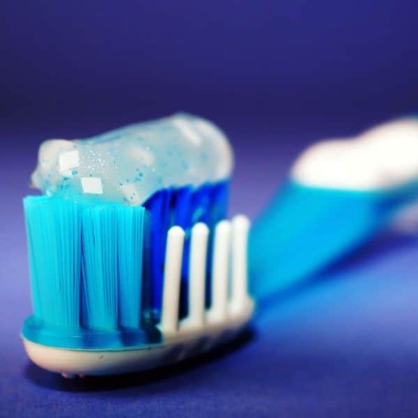 a toothbrush with toothpaste on it