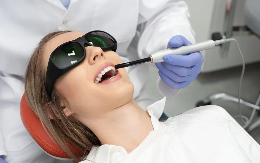 Using-a-modern-method-of-laser-teeth-treatment.jpg